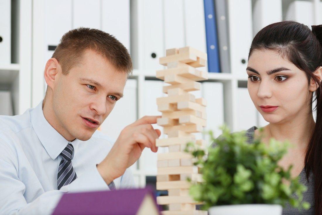 businessman-plays-strategy-jenga-hand.jpg