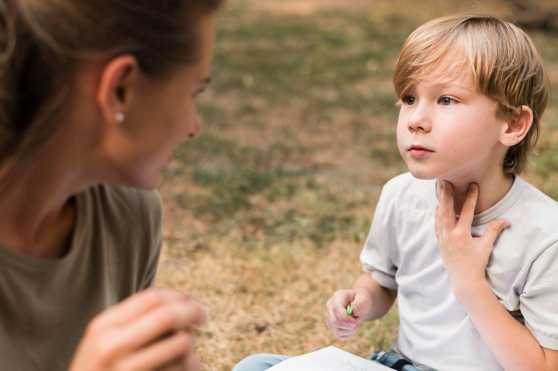 close-up-teacher-boy-outdoors.jpg