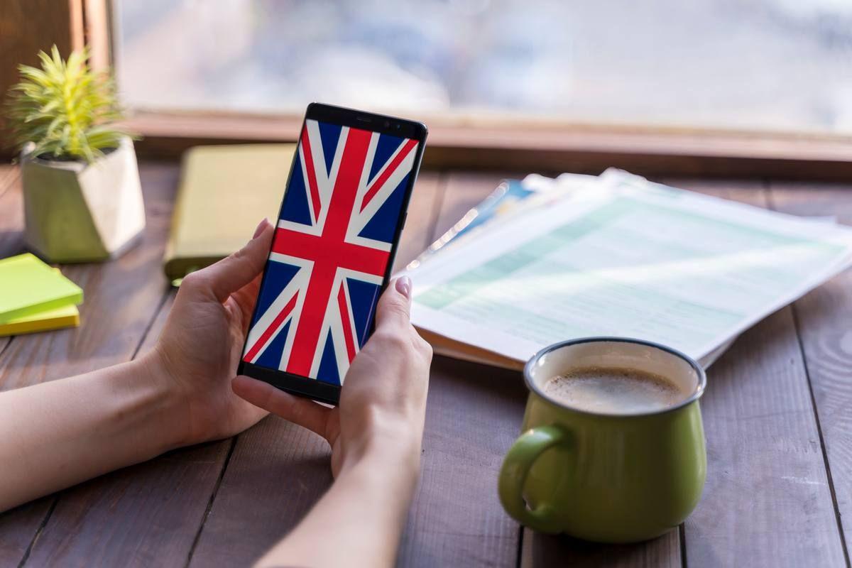 close-up-woman-with-smartphone-coffee-cup.jpg