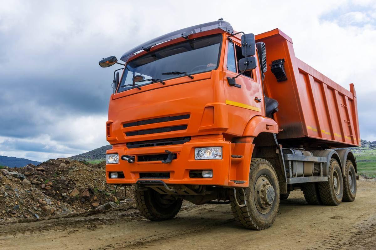 dump-truck-rides-mountain-road-construction.jpg