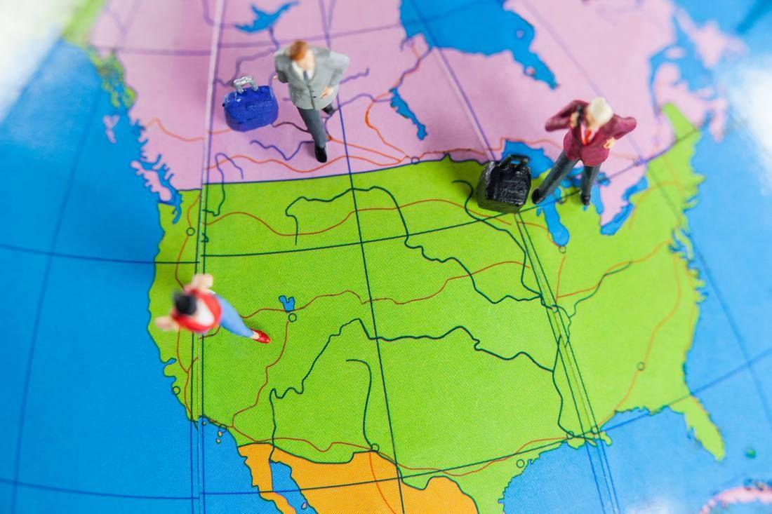 miniature-people-travelling-globe.jpg