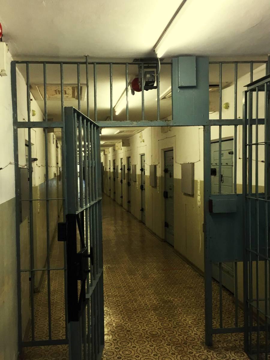open-gate-corridor-empty-prison.jpg