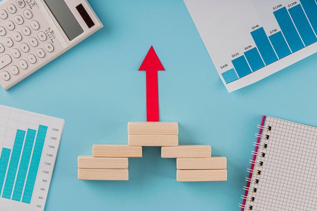 top-view-business-items-with-growth-chart-arrow.jpg
