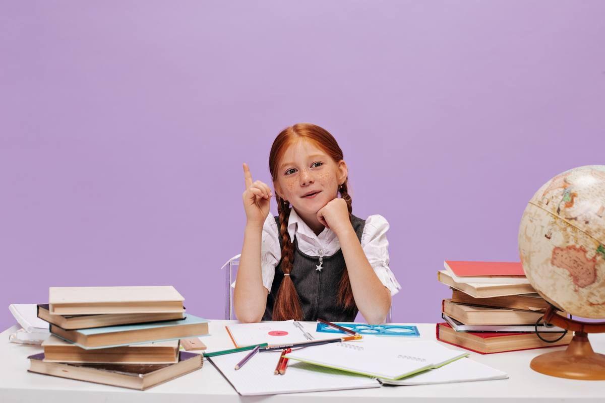 cute-little-schoolgirl-with-freckles-modern-pigtails-white-shirt-sarafan-has-idea-purple-isolated-wall.jpg