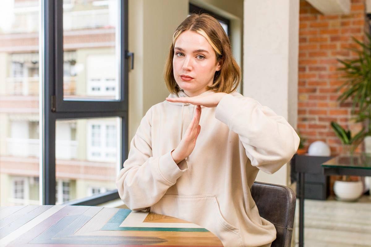 looking-serious-stern-angry-displeased-making-time-out-sign_m.jpg