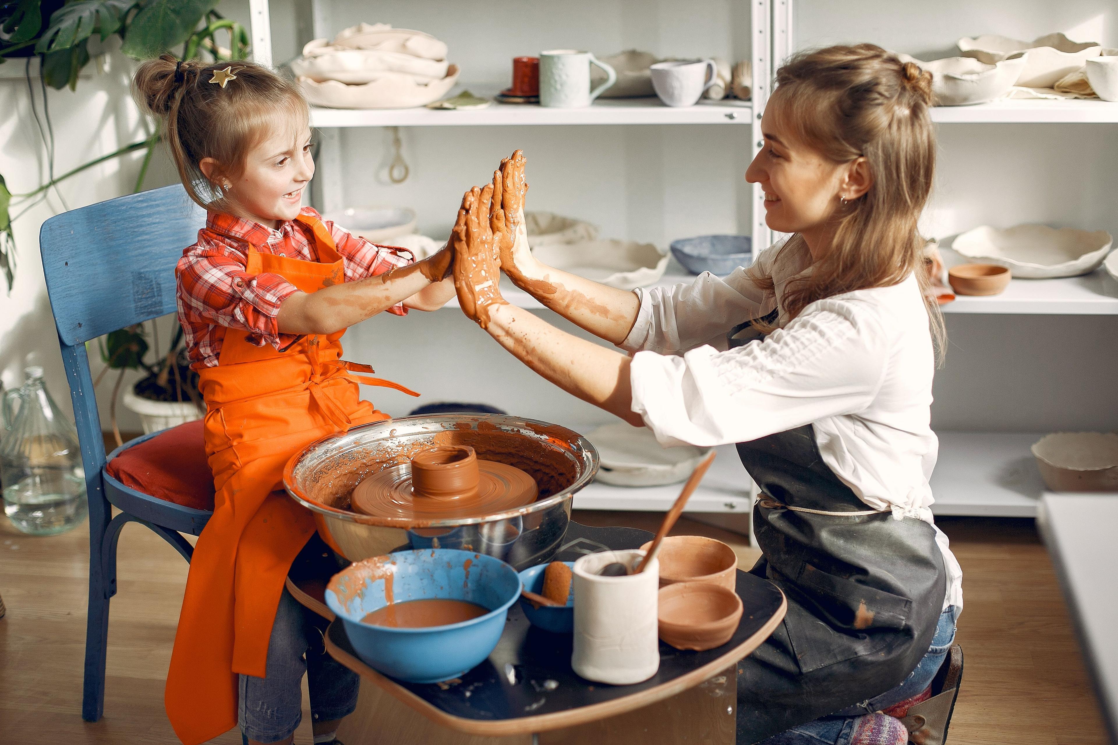 people-making-vaze-from-clay-pottery-s-machine.jpg