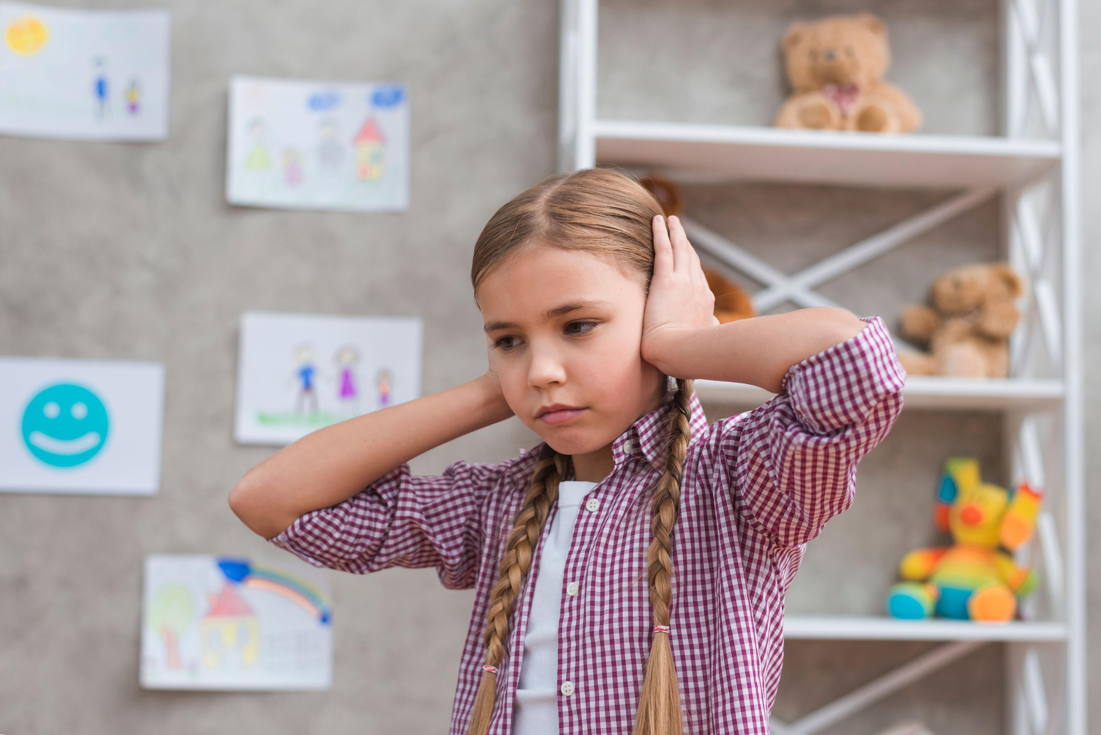 portrait-sad-girl-covering-her-ears-with-two-hands.jpg