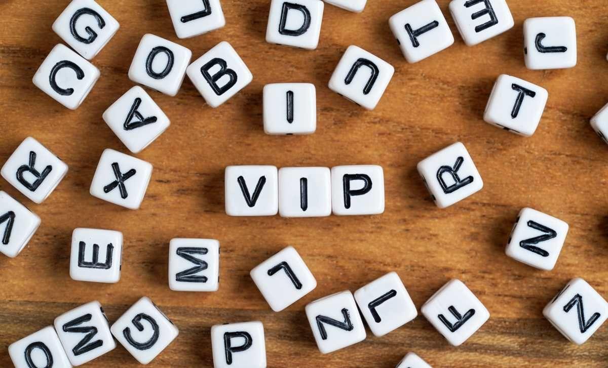 small-white-black-bead-cubes-wooden-board-letters-middle-spell-vip-very-important-person-concept_tn.jpg