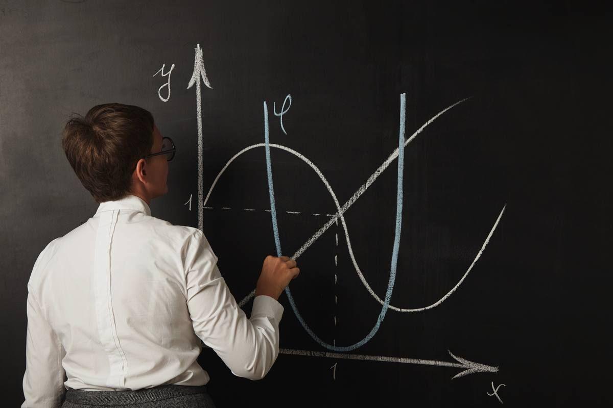 young-female-teacher-finishing-draw-her-chart-mathematics-class-blackboard.jpg